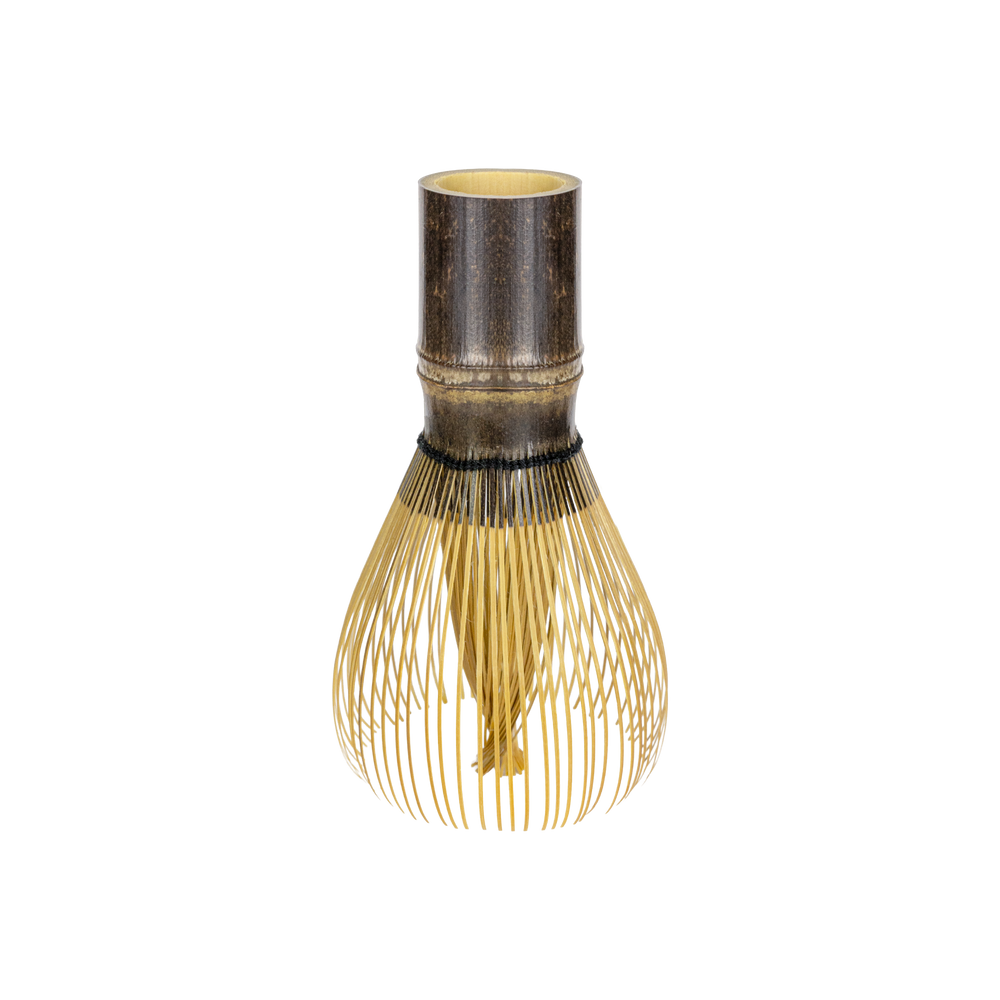 A traditional Japanese bamboo whisk (chashaku) with a dark brown bamboo top and fine gold-colored whisking bristles, isolated on a white background.