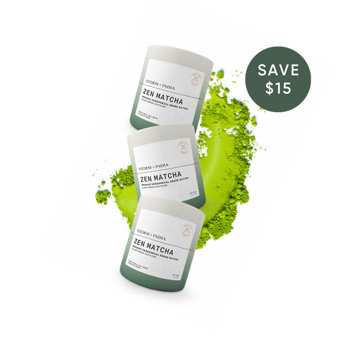 Three jars of Storm + India Zen Matcha loose leaf matcha powder arranged diagonally on a white background with a green powder spill behind them and a dark green 'SAVE $15' badge in the top right.